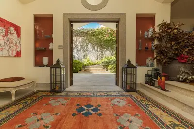 an open door into a room with a rug at CASA DA LEVADA in Funchal