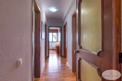 a hallway with a door and a room with a bed at Condo Magnolia in Funchal