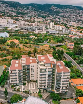 an aerial view of a city with tall buildings at Condo Magnolia in Funchal