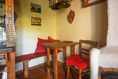 a small room with a table and chairs in a room at Madeira-Meerblick-Haus in Estreito da Calheta
