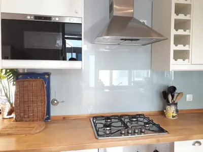 a kitchen with a stove top oven in a kitchen at Peaceful Top Floor Apt W Balconies - Cambridge RIGHT - AC in Funchal