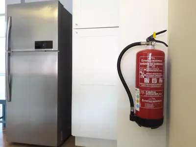 a fire hydrant is next to a refrigerator at Peaceful Top Floor Apt W Balconies - Cambridge RIGHT - AC in Funchal