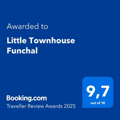 a blue screen with the text awarded to little townhome funeral at Little Townhouse Funchal in Funchal