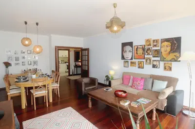 a living room with a couch and a table at Apartamento Quinta do Faial in Funchal