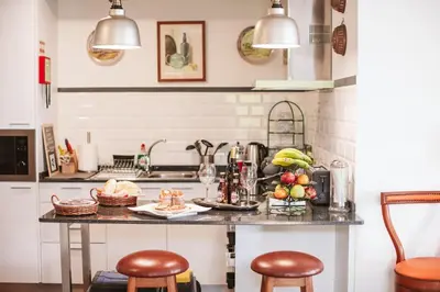 a kitchen with a counter with fruits on it at The Waves Studios by Amazing Madeira in São Vicente