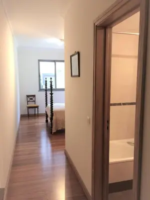 a hallway with a door leading to a bedroom at Rochas Shared Apart Garden Refuge in Funchal