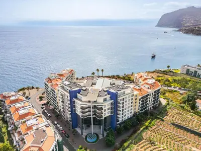 an aerial view of a building next to the ocean at Golden View by Homie in Funchal