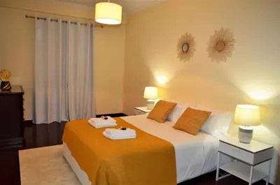 a bedroom with a bed with towels on it at Golden View by Homie in Funchal