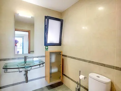 a bathroom with a sink and a toilet and a mirror at Villa North Sea by LovelyStay in Ponta Delgada