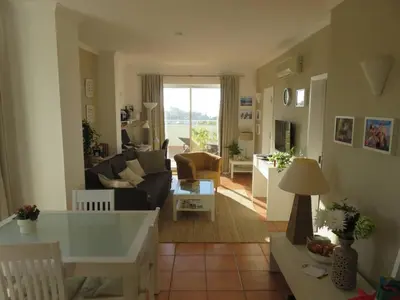 a living room with a couch and a table at Sweden Apartment - Top Floor one bedroom with sea views - RS in Lagos
