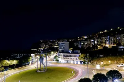 a view of a city at night with lights at Cozy T2 with Ocean View in Funchal