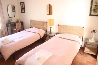 a room with two beds and a mirror at Amazing Beach House in Algarve with Sea View! in Luz