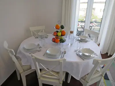 a white table with a bowl of fruit on it at Market Downtown T3 in Funchal