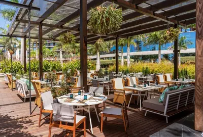 a restaurant with tables and chairs on a deck at Savoy Palace - The Leading Hotels of the World - Savoy Signature in Funchal