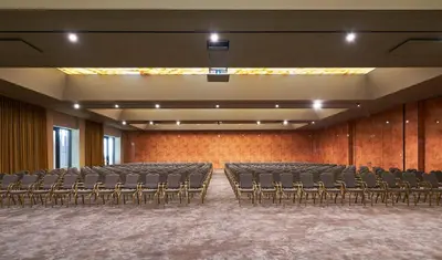 an empty auditorium with empty chairs in a room at Savoy Palace - The Leading Hotels of the World - Savoy Signature in Funchal