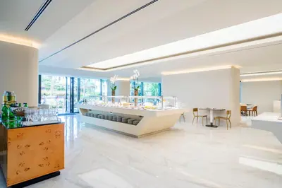 a large white room with a counter with glasses at Savoy Palace - The Leading Hotels of the World - Savoy Signature in Funchal