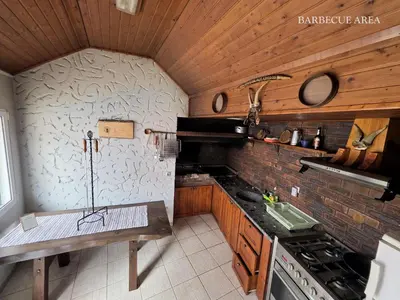 a kitchen with a stove and a counter top at Quintinha do Álvaro - Holiday house in Santana