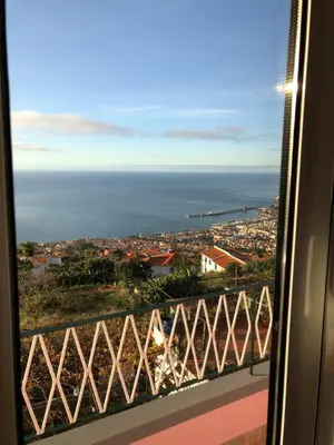 a view of the ocean from a train window at City View Gardens II in Funchal