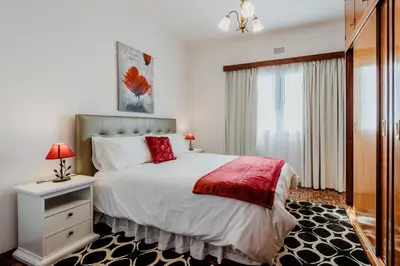 a bedroom with a large bed and a window at City View Gardens I in Funchal
