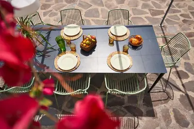 a table with baskets and food on top of it at Bordal Houses in Funchal