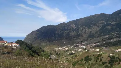 a view of a mountain with a town on a hill at Matilde House in São Vicente