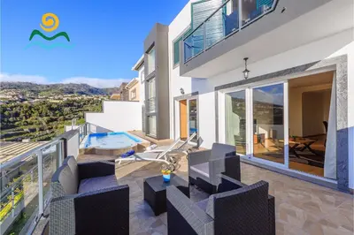 a villa with a view of the city at OurMadeira - Casa da Belita in Calheta