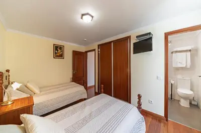 a villa with a swimming pool and a house at OurMadeira - Theo's House in Calheta