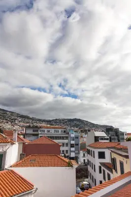 a view from the roofs of buildings in a city at Apartamentos Funchal by Petit Hotels in Funchal