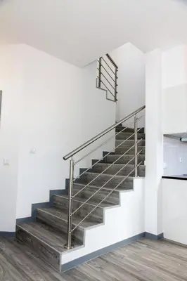 a staircase in a house with white walls and wood floors at Apartamentos Funchal by Petit Hotels in Funchal