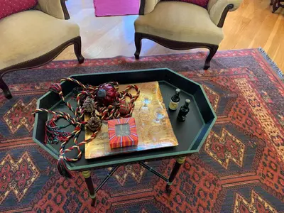 a table on a rug with a bowl of food on it at Vila Tagus Garajau in Caniço