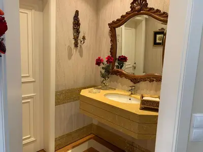 a bathroom with a sink and a mirror at Vila Tagus Garajau in Caniço