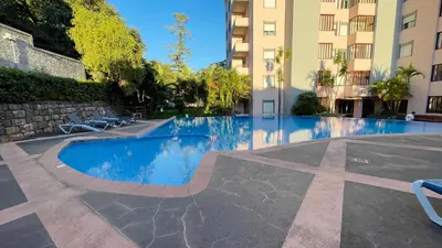 a swimming pool in the middle of a building at Apto Barreiro by Susy's Holidays in Funchal