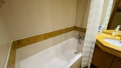 a bathroom with a tub and a sink at Apto Barreiro by Susy's Holidays in Funchal