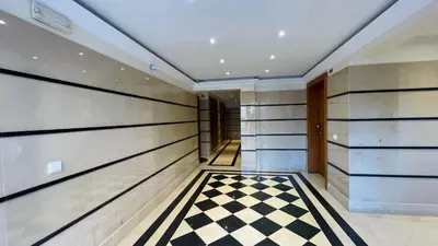 a hallway with a checkered floor in a house at Apto Barreiro by Susy's Holidays in Funchal