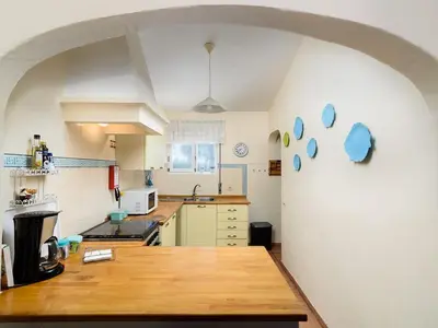 a kitchen with a wooden counter top in a room at Villa Luz Bay w Private Pool in Luz