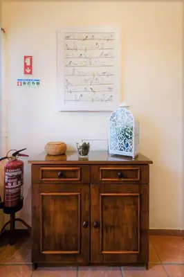 a wooden cabinet in the corner of a room at Villa Luz Bay w Private Pool in Luz