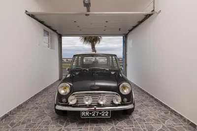 a small black car parked in a garage at CAPTAIN´S HOUSE in Paul do Mar
