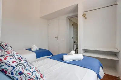 a bathroom with a toilet and a sink at Casa das Furnas - Eco Home in Vila do Bispo