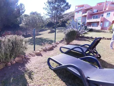 a couple of benches sitting in a yard at Vista da Atlantica in Luz