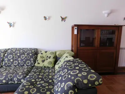 a living room with a couch with pillows on it at Vista da Atlantica in Luz