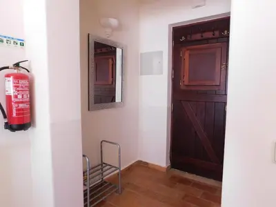 a room with a fire hydrant next to a door at Vista da Atlantica in Luz