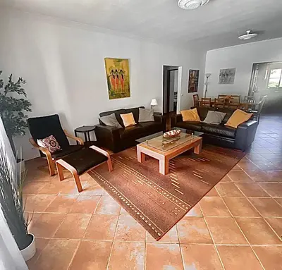 a living room with couches and a coffee table at Holiday villa with pool near the ocean, fast internet, Aljezur in Aljezur