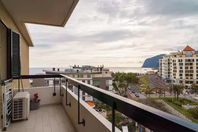 a balcony with a view of the ocean at Golden escape in Funchal in Funchal