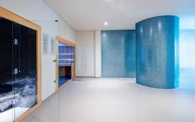 a room with blue tiles on the walls at Hotel Baia Azul in Funchal