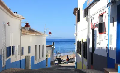 a street in positano with the ocean in the background at Casa Praia Mar in Salema