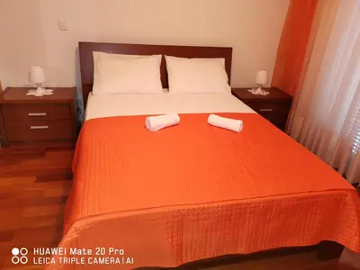 a bedroom with a bed with two towels on it at Andrade Blue in Caniço