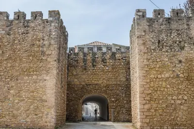 an entrance to a castle with a person walking through it at Vilita in Lagos