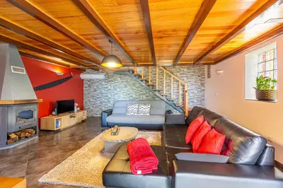 a living room with a couch and a table at Refúgio do Lourinho in Funchal