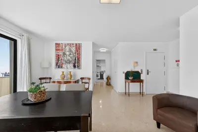 a balcony with a table and chairs on a balcony at Two Bedroom Apartment with Balcony and Gorgeous view over the Atlantic in Funchal