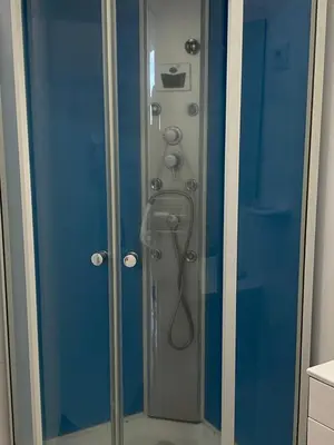 a shower with a glass door in a bathroom at SLICE OF PONTA DO SOL- GROUND FLOOR- SEA VIEW in Ponta do Sol